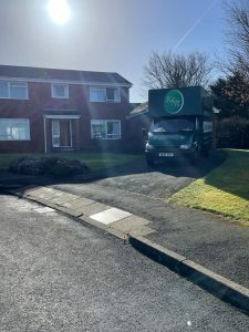 Kwikshift Removals & Storage van on a driveway.